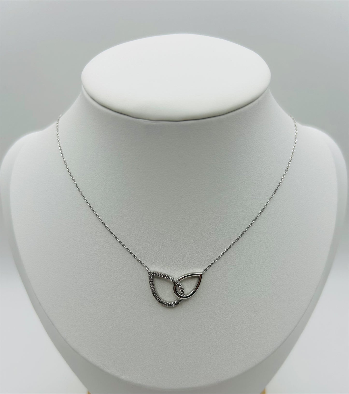 Interlocking Tear-drop Pendant (.12pts t.w.) in Sterling Silver